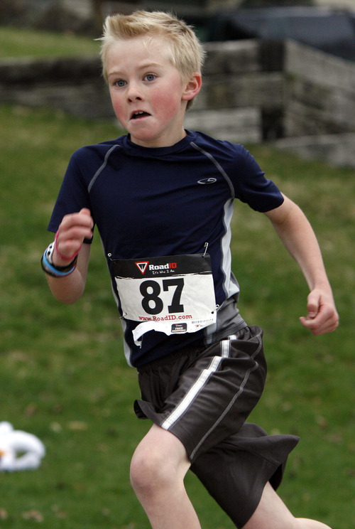Rick Egan  |  The Salt Lake Tribune
Third grade runner Spencer Lee approaches the finish line of the 5K race, at the Tulip Trot fundraiser for Muir Elementary in Bountiful, Saturday, April 13, 2013.  The fundraiser featured a 1-mile run, a 5K run, a Pancake breakfast, and a silent auction.