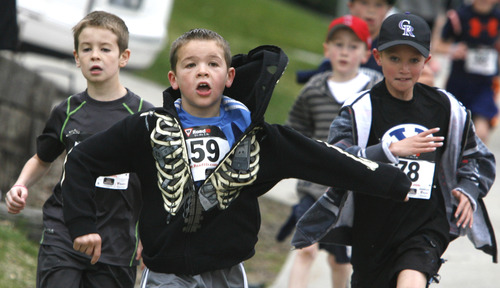 Rick Egan  | The Salt Lake Tribune 

Little runners fight for position, near the end of the 1-mile race, at theTulip Trot fundraiser for Muir Elementary in Bountiful, Saturday, April 13, 2013.