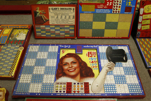 Francisco Kjolseth  |  The Salt Lake Tribune
Clark Phelps a long-time Midvale businessman who owns what is probably the world's largest collection of punchboards displays the graphically interesting and colorful games of chance that were outlawed in 1979. With a small key you would push through the small hole that would punch out a piece of paper revealing your prize. Some have pennies, drawings, lighters, decks of cards, etc., as part of the display. People would buy a chance, punch out the ticket and hope to win at bars, coffee shops, even the Hotel Utah.