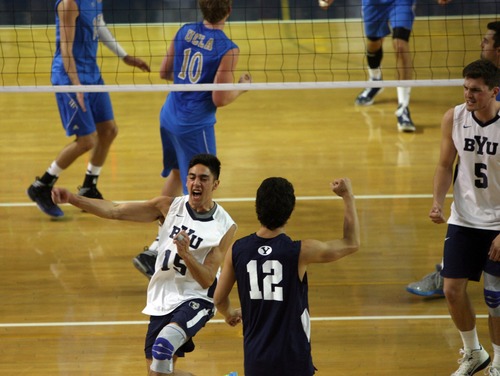 Kim Raff  |  The Salt Lake Tribune
BYU players Taylor Sander and (right) Jaylen Reyes celebrate scoring a point against UCLA during the semifinals of the MPSF Volleyball Tournament at the Smith Fieldhouse in Prove on April 25, 2013.  BYU went on to win the match 3-2 after trailing UCLA by two sets.