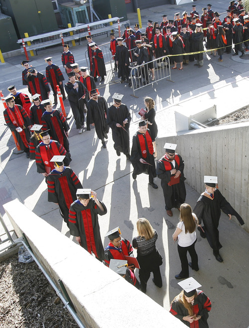 Rick Egan  | The Salt Lake Tribune 

Graduates make their way into the Huntsman Center, at the University of Utah Graduation, Thursday, May 2, 2013.