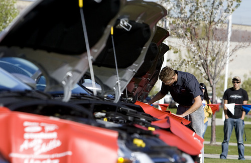 Kim Raff  |  The Salt Lake Tribune
Davis High School student Zachary Delbo works under the hood of a vehicle during the Ford/AAA Student Auto Skills competition on the Miller Campus of Salt Lake Community College in Sandy on May 2, 2013.  Automotive technology students from 20 of Utah's high schools compete with each other in debugging cars in a timed competition. The winner will travel to Ford's Headquarters in Dearborn, Mich., for the national finals.
