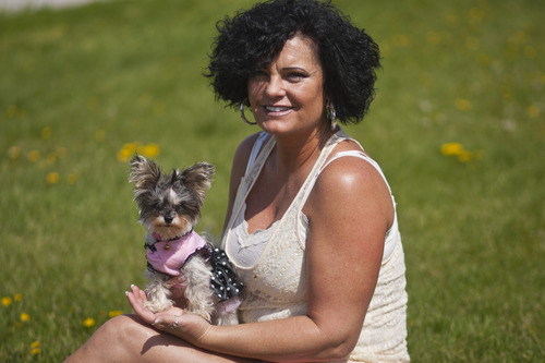 Chris Detrick  |  The Salt Lake Tribune
Alicia Caldwell-Kesler and her dog Roxy, pose for a portrait outside of her business Main Street Hair & Nail Design in Magna Friday May 3, 2013.