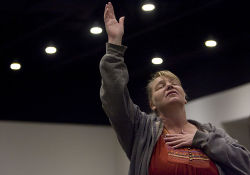 Kim Raff  |  The Salt Lake Tribune
Church member Shannon Waters stands during a worship service Thursday for the 62nd National Day of Prayer at Calvary Chapel of Salt Lake. "Prayer is important and today is the day for us to pray for our country," says Waters.