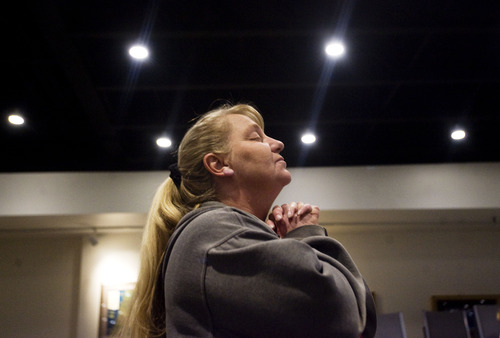 Kim Raff  |  The Salt Lake Tribune
Church member Shannon Waters stands during a worship service Thursday for the 62nd National Day of Prayer at Calvary Chapel of Salt Lake. "Prayer is important and today is the day for us to pray for our country," says Waters.