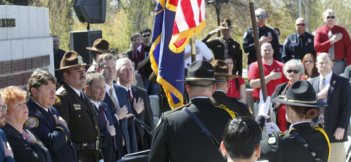 Al Hartmann  |  The Salt Lake Tribune
Police officers and state leaders stand for law enforcement color guard during ceremony to honor fallen officers at a memorial at the Utah Capitol Thursday, May 2.