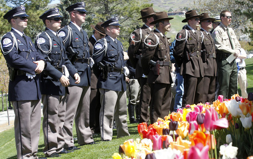 Al Hartmann  |  The Salt Lake Tribune
Police officers from around the state and state leaders gather Thursday for a ceremony to honor fallen officers at a memorial at the state Capitol.