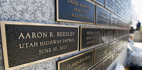 Al Hartmann  |  The Salt Lake Tribune
The name of UHP Trooper Aaron Beesley now appears on a state Capitol memorial wall of officers who died in the line of duty. He died last year. His name was added at a memorial cermony at the Capitol Thursday, May 2.