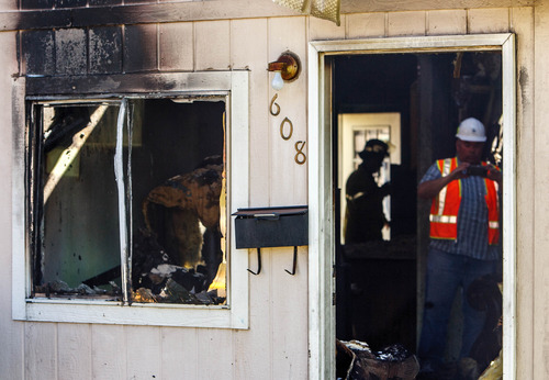 Trent Nelson  |  The Salt Lake Tribune
Firefighters at the scene of a home that caught fire at 600 North 800 West, Friday May 3, 2013 in Salt Lake City.