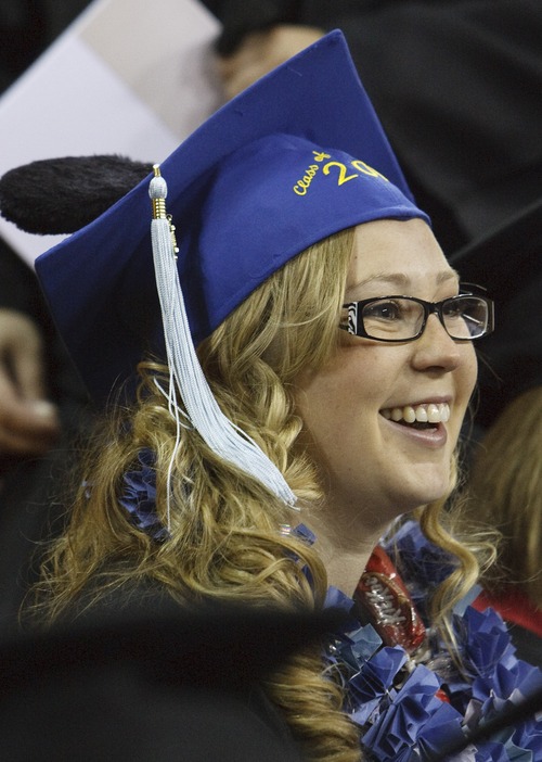 Leah Hogsten  |  The Salt Lake Tribune
Graduate Kathy Jo Hanson sported ears on her mortarboard, wearing a cap from Disneyland, during Utah State University's commencement at the Dee Glen Smith Spectrum in Logan, Saturday, May 4, 2013.