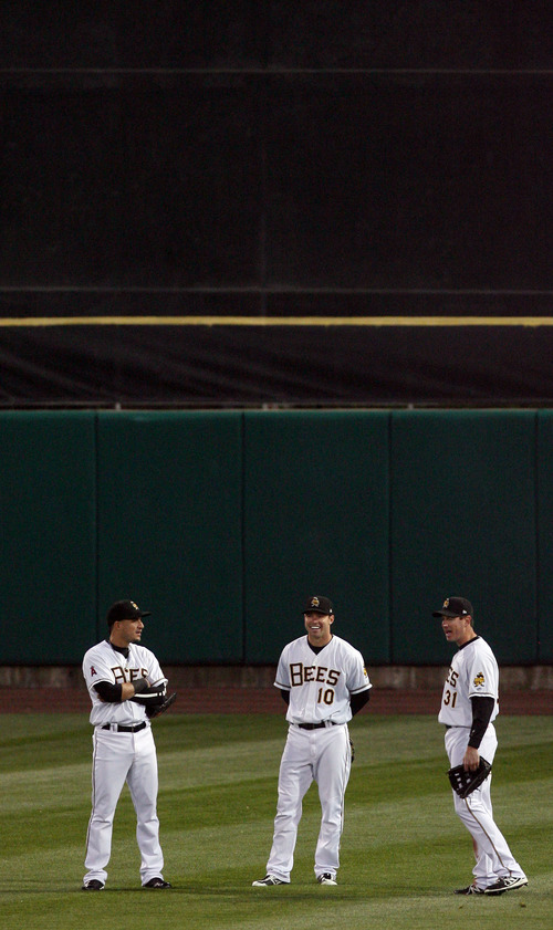 Steve Griffin | The Salt Lake Tribune

Bees outfielders Roberto Lopez, Trent Oeltjen and Brad Hawpe meet in centerfield during a pitching change in the Bees versus Sky Sox baseball game at Spring Mobile Ballpark in Salt Lake City, Utah Wednesday May 1, 2013.