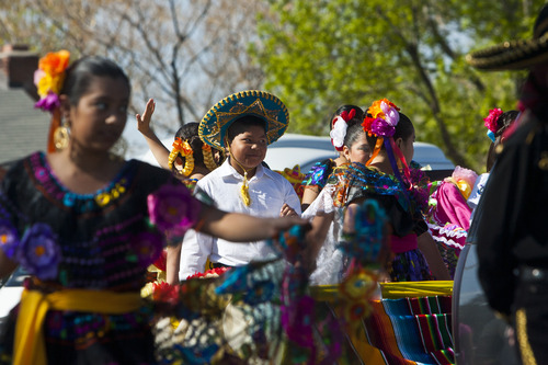 Chris Detrick  |  The Salt Lake Tribune
Members of the West Side Dancers from Salt Lake City dance in the 26th annual Cinco de Mayo parade near Midvale City Park Saturday May 4, 2013.