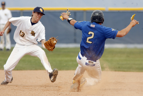 Rick Egan  | The Salt Lake Tribune 

Summit Academy short-stop Stephen Crandall (13) tags San Juan's  Barkley Christensen (2) out at second on a stolen base attempt, in prep 2A playoff action, San Juan vs. Summit Academy, Saturday, May 4, 2013.