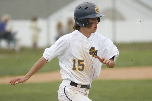 Rick Egan  | The Salt Lake Tribune 

Summit Academy's Dallin Schipaanboord (15) beats the throw to first, in prep 2A playoff action, San Juan vs. Summit Academy, Saturday, May 4, 2013.