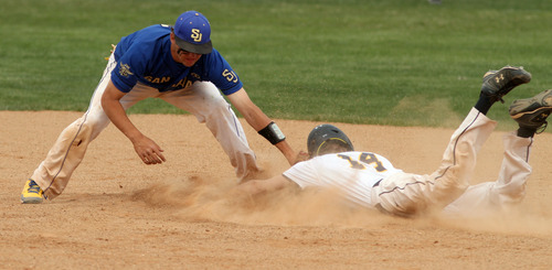 Rick Egan  | The Salt Lake Tribune 

San Juan's Barkley Christensen (2), tags Summit Academy's  Glenn Gilliland (14) out at second on a stolen base attempt, in prep 2A playoff action, Friday, January 13, 2012.