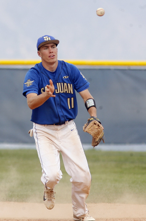 Rick Egan  | The Salt Lake Tribune 

San Juan's short-stop Logan Meyer, tosses the ball to second base for a force out, for the last out of the game,  in prep 2A playoff action, Saturday, May 4, 2013.