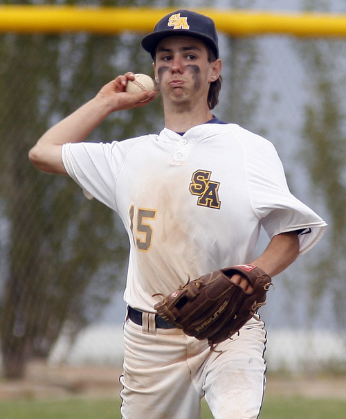 Rick Egan  | The Salt Lake Tribune 

Summit Academy Short-stop Dallin Schipaanboord (15) throws to first for an out, in prep 2A playoff action, San Juan vs. Summit Academy, Saturday, May 4, 2013.