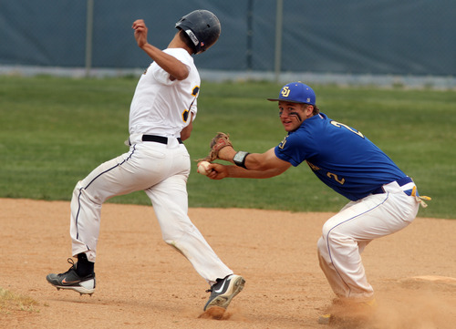 Rick Egan  | The Salt Lake Tribune 

Ryan Williamson (3), Summit Academy, is tagged out by San Juan's Barkley Christensen (2), in prep 2A playoff action, Saturday, May 4, 2013.