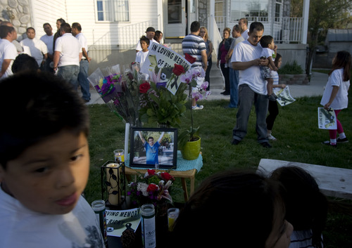 Kim Raff  |  The Salt Lake Tribune
Friends and family gather around a memrial for Ricardo Portillo on Sunday in Salt Lake City. Portillo died Saturday a week after police say a player punched him in the head during a game.
