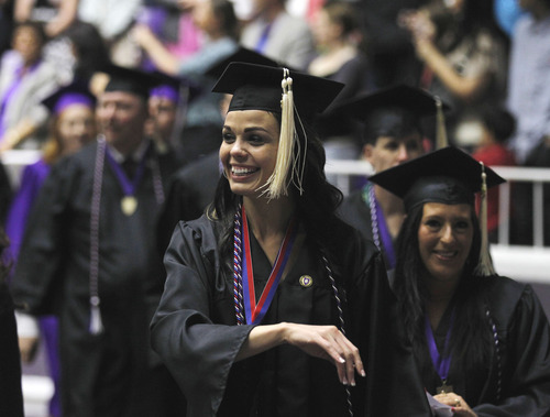 Al Hartmann  |  The Salt Lake Tribune
Iraqi war veteran Jen Carver Comer marches in the Weber State University graduation procession into the Dee Events Center. She graduated with two degrees from WSU on Friday, April 26.