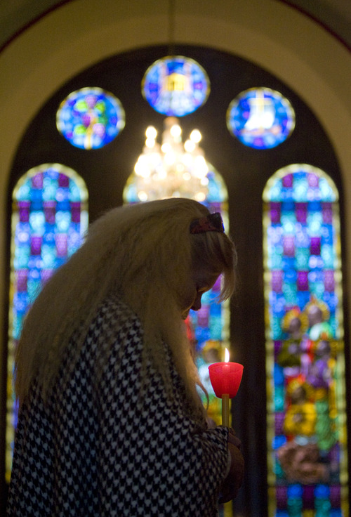 Kim Raff  |  The Salt Lake Tribune
Margie Pettit attends the Agape Vespers service, which culminates the end of Holy Week festivities for the Orthodox Christian faith, at the Holy Trinity Cathedral in Salt Lake City on May 5, 2013. Pettit holds a candle throughout the service that represent the light of Christ.