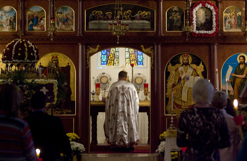 Kim Raff  |  The Salt Lake Tribune
Father Matthew Gilbert leads the Agape Vespers service, which culminates the end of Holy Week festivities for the Orthodox Christian faith, at the Holy Trinity Cathedral in Salt Lake City on May 5, 2013. He is carrying a candle the symbolizes the light of Christ.