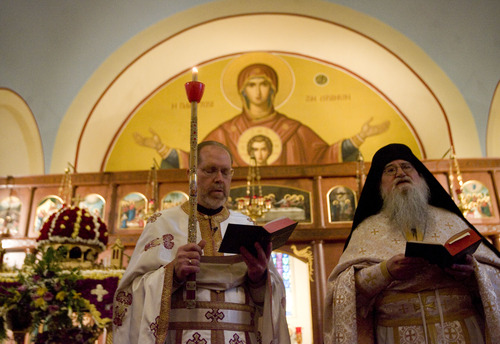 Kim Raff  |  The Salt Lake Tribune
(left) Father Matthew Gilbert and (right) Priest Monk Mark, a visiting Serbian Orthodox priest, lead the Agape Vespers service, which culminates the end of Holy Week festivities for the Orthodox Christian faith, at the Holy Trinity Cathedral in Salt Lake City on May 5, 2013.