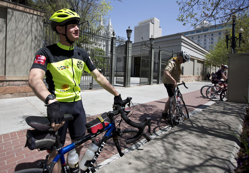 Lennie Mahler  |  The Salt Lake Tribune
Joe McGrath mounts his cycle in front of the LDS Temple in Salt Lake City, Utah, Sunday, May 5, 2013. Joe, an Army Specialist, and his dad, Dave, are riding 1,800 miles from Idaho to the Boy Scouts of America National Meeting in Irving, Texas, to demonstrate against the BSA ban on gay scout leaders.
