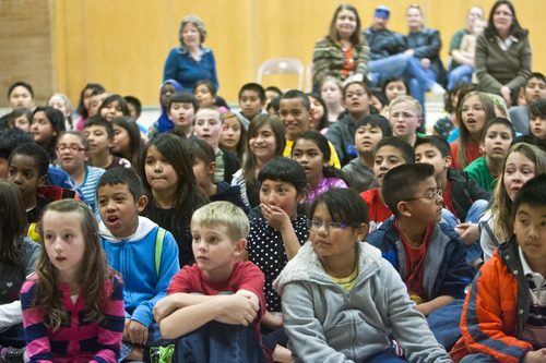 Chris Detrick  |  The Salt Lake Tribune
Students watch as Lisa Hugueley shows off 'Bakari,' a black-and-white ruffed lemur during SeaWorld San Diego's "SeaWorld Cares" program at Hillsdale Elementary School in West Valley City Wednesday April 17, 2013. The SeaWorld Cares educational outreach program teaches kids about ocean conservation, animal rescue and rehabilitation, and how people's everyday actions can make safer habitats for animals.