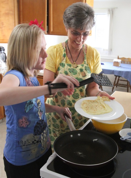 Rick Egan  | The Salt Lake Tribune

Ashley Janzen 12, cooks Swedish Pancakes with her grandma, Merri Lou Ericson. Ashley has been cooking with her grandma since she was about 9 years old.