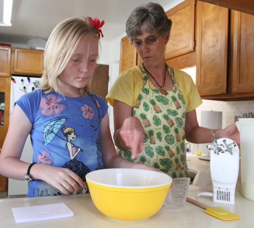 Rick Egan   |  The Salt Lake Tribune
Merri Lou Ericson and granddaughter Ashley Janzen, 12, cook Swedish pancakes Monday, April 29, 2013.