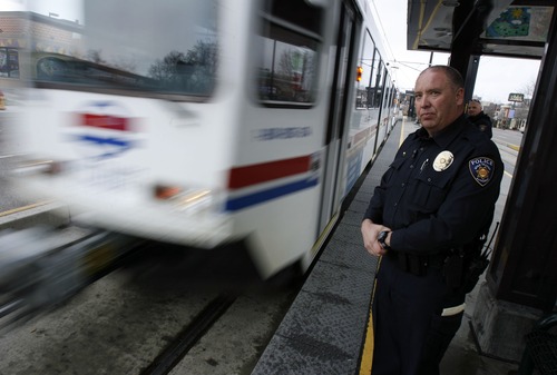 Francisco Kjolseth  |  Tribune file photo    
Utah Transit Authority officer Lloyd Davis gets ready to board TRAX. The agency's board is exploring whether to keep or dump its 82-officer police department.