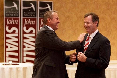 Trent Nelson  |  Tribune file photo
Utah Attorney General Mark Shurtleff, left, and Republican attorney general nominee John Swallow share a laugh at a campaign event.