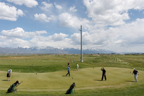 Trent Nelson  |  The Salt Lake Tribune
Golfers at Wingpointe Golf Course in Salt Lake City, Thursday May 9, 2013. The city-owned course is operating as usual for the 2013 season although a pending demand from the FAA could cause a dramatic increase in Wingpointe's lease.