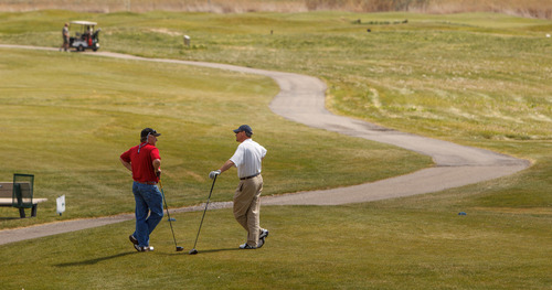 Trent Nelson  |  The Salt Lake Tribune
Golfers at Wingpointe Golf Course in Salt Lake City, Thursday May 9, 2013. The city-owned course is operating as usual for the 2013 season although a pending demand from the FAA could cause a dramatic increase in Wingpointe's lease.