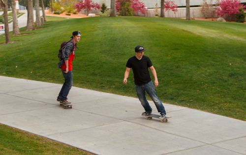 Trent Nelson  |  The Salt Lake Tribune
A pair of skateboarders ride through the University of Utah campus in Salt Lake City, Tuesday May 7, 2013. The university is considering a ban on skateboarding.