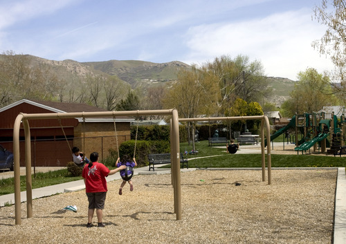 Kim Raff  |  The Salt Lake Tribune
(left) Isaiah and (right) Isabella Montoya are pushed on the swings by their aunt Michelle Enriquez at Joseph F. Steenblik Park in the Rose Park neighborhood in Salt Lake City on April 29, 2013.