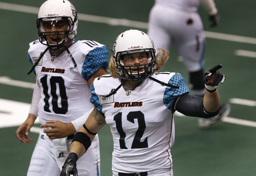 Scott Sommerdorf   |  The Salt Lake Tribune
Arizona Rattlers WR Tysson Poots who played at Southern Utah Univ., points to fans after he scored a first half TD against The Blaze. The Blaze were down 33-28 at the half in their Arena League home opener against the Arizona Rattlers, Friday, March 29, 2013.