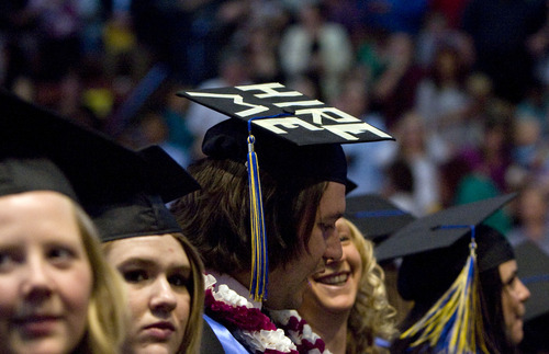 Kim Raff  |  The Salt Lake Tribune
Alejandro Moreno displays "Hire Me" on his mortar board during the Salt Lake Community College Commencement Program at the Maverik Center in West Valley City on May 9, 2013.