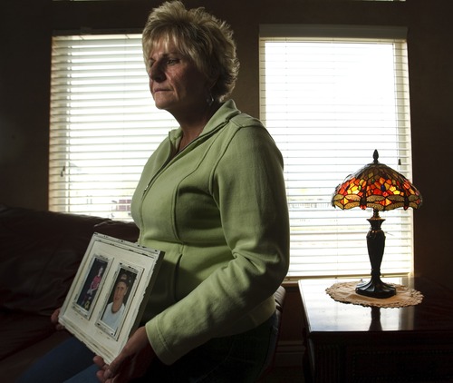 Leah Hogsten  |  The Salt Lake Tribune
Lyn McGuire holds a photo of her son Kourt on Wednesday, May 1, 2013. McGuire and her husband, Ken, began an LDS Church-affiliated support group for those who've lost family members to suicide after their son Kourt took his own life.