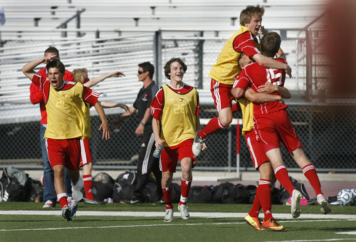 Scott Sommerdorf   |  The Salt Lake Tribune
Park City celebrates after they defeated Desert Hills 2-1 in the 3A boys' soccer state semifinal, Friday, May 10, 2013. They advance to tomorrow's 3A final.