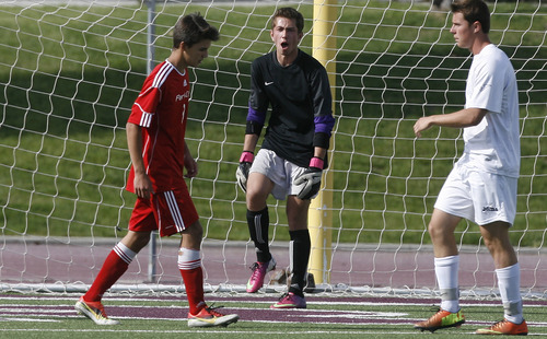 Scott Sommerdorf   |  The Salt Lake Tribune
Park City goalkeeper Connor Dawson yells encouragement to his defense as they ready for a corner kick. Park City defeated Desert Hills 2-1 in the 3A boys' soccer state semifinal, Friday, May 10, 2013. They advance to tomorrow's 3A final.