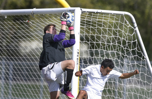 Scott Sommerdorf   |  The Salt Lake Tribune
Park City goaltender Connor Dawson makes a save during first half play. Park City defeated Desert Hills 2-1 in the 3A boys' soccer state semifinal, Friday, May 10, 2013. They advance to tomorrow's 3A final.