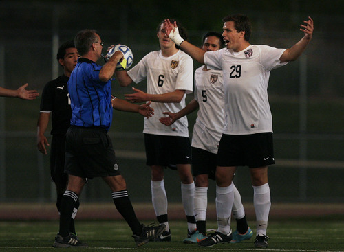 Scott Sommerdorf   |  The Salt Lake Tribune
Fredrick Larsen of Wasatch, #29, complains as the referee pulls out a yellow card against him for rough play during second half play. Wasatch beat Ogden 2-1 in OT in the 3A boys' soccer state semifinal at the half, Friday, May 10, 2013.