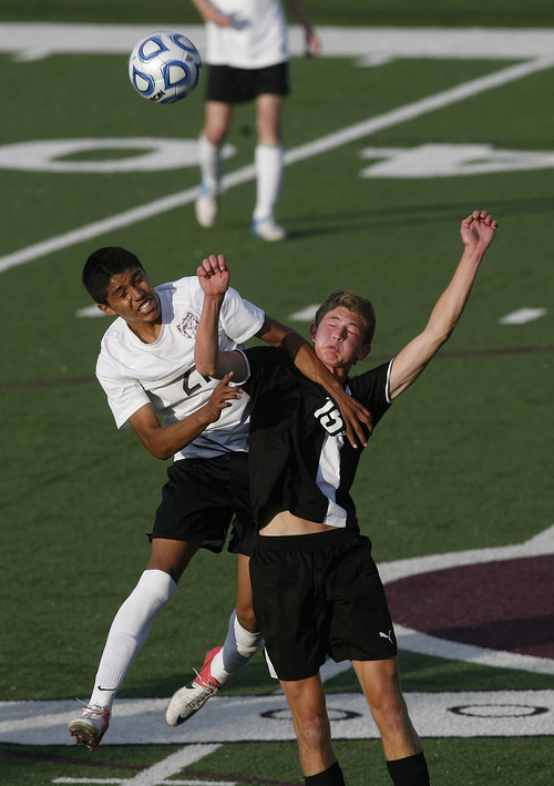 Scott Sommerdorf   |  The Salt Lake Tribune
Domey Espinoza of Wastach, left, battles with Dayton Wright for the ball during first half play. Wasatch beat Ogden 2-1 in OT in the 3A boys' soccer state semifinal at the half, Friday, May 10, 2013.