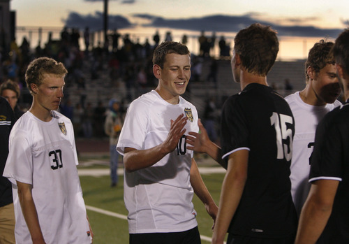 Scott Sommerdorf   |  The Salt Lake Tribune
Ben Powell gets congratulations from Ogden players after the game in which he scored the winning goal in OT. Wasatch beat Ogden 2-1 in OT in the 3A boys' soccer state semifinal at the half, Friday, May 10, 2013.