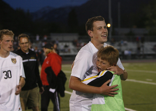 Scott Sommerdorf   |  The Salt Lake Tribune
Ben Powell gets hugs after scoring the winning goal in OT. Wasatch beat Ogden 2-1 in OT in the 3A boys' soccer state semifinal at the half, Friday, May 10, 2013.