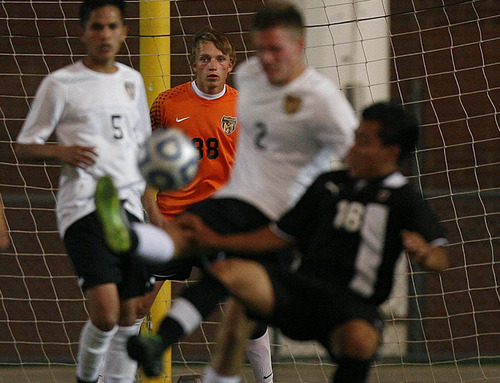 Scott Sommerdorf   |  The Salt Lake Tribune
Wasatch goalkeeper Cody Cowley keeps an eye on the ball as Ogden battles near the box during second half play. Wasatch beat Ogden 2-1 in OT in the 3A boys' soccer state semifinal at the half, Friday, May 10, 2013.