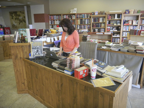 Tom Wharton  |  The Salt Lake Tribune
Cindy Dumas, owner of Marissa's Books in Murray, works behind the counter at her newly opened store.