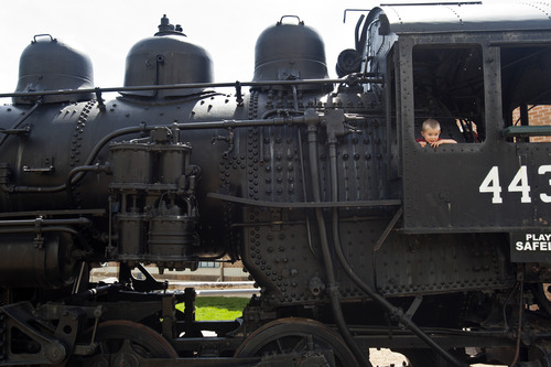 Chris Detrick  |  The Salt Lake Tribune
Two-year-old Callen Wilcox, of Provo, explores the Union Pacific steam engine #4436 during National Train Day at Union Station in Ogden Saturday, May 11, 2013.